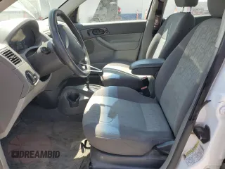 2005 Ford Focus S with VIN 1FAFP34N05W296550, listed as a Copart auction lot 59391835 with 216,509 mi miles and Salvage title. Bid and sale history available at DreamBid. Image 7.