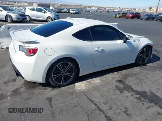 2015 Scion FR-S with VIN JF1ZNAA12F9709707, listed as a IAAI auction lot 41545940 with 107,575 mi miles. Bid and sale history available at carsss.com. Image 4.