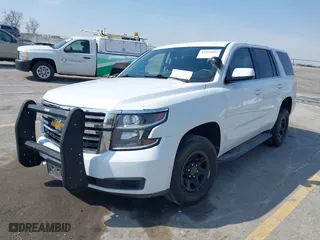 2020 Chevrolet Tahoe Commercial with VIN 1GNSKDEC5LR261015, listed as a IAAI auction lot 42001083 with 110,668 mi miles. Bid and sale history available at carsss.com. Image 2.