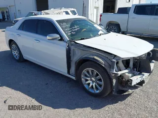 2014 Chrysler 300 with VIN 2C3CCAEG4EH312930, listed as a IAAI auction lot 41907509 with 128,940 mi miles. Bid and sale history available at carsss.com. Image 1.