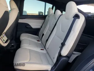 2023 Tesla Model X with VIN 7SAXCAE5XPF384061, listed as a Copart auction lot 86834084 with 6,974 mi miles and Salvage Title. Bid and sale history available at DreamBid. Image 12.