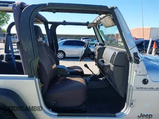 2002 Jeep Wrangler X with VIN 1J4FA39S42P763835, listed as a IAAI auction lot 42302645 with 233,634 mi miles and . Bid and sale history available at DreamBid. Image 5.