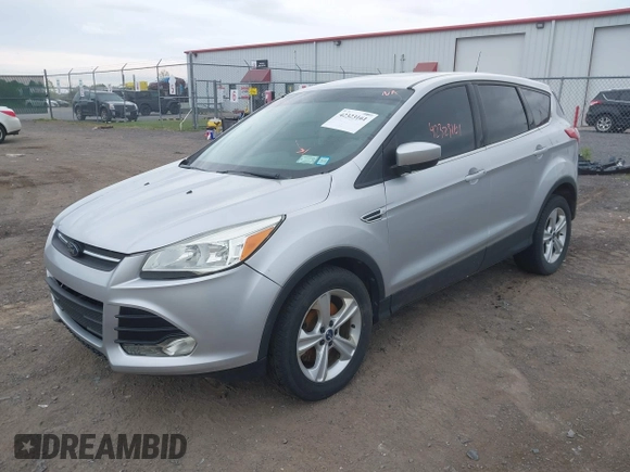 2014 Ford Escape SE z VIN 1FMCU9GX9EUC35713, wystawiony jako IAAI lot #42323161 z przebiegiem 169 393 mil mil oraz . Historia ofert i sprzedaży dostępna na DreamBid. Obrazek 2.