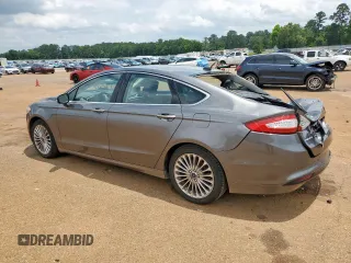 2014 Ford Fusion Titanium Hybrid with VIN 3FA6P0RU2ER158302, listed as a Copart auction lot 59049995 with 108,571 mi miles and Salvage title. Bid and sale history available at DreamBid. Image 2.
