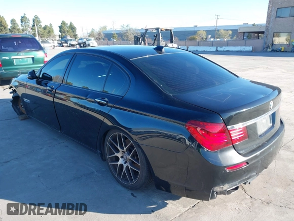2014 BMW 7 Series 740Li with VIN WBAYE4C56ED137847, listed as a IAAI auction lot 39452255 with 184,471 mi miles. Bid and sale history available at carsss.com. Image 3.