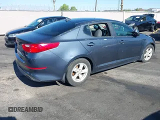 2015 Kia Optima LX z VIN KNAGM4A73F5605256, wystawiony jako IAAI lot #42459022 z przebiegiem 180 233 mil mil oraz . Historia ofert i sprzedaży dostępna na DreamBid. Obrazek 4.
