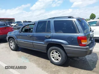 2004 Jeep Grand Cherokee Laredo with VIN 1J4GX48S44C205469, listed as a IAAI auction lot 42310571 with 154,929 mi miles and . Bid and sale history available at DreamBid. Image 14.