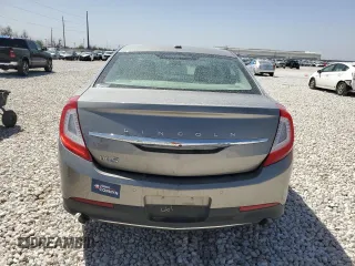 2016 Lincoln MKS z VIN 1LNHL9DK8GG600661, wystawiony jako Copart lot #49648655 z przebiegiem 56 655 mil mil oraz Szkoda całkowita • Salvage title. Historia ofert i sprzedaży dostępna na DreamBid. Obrazek 6.