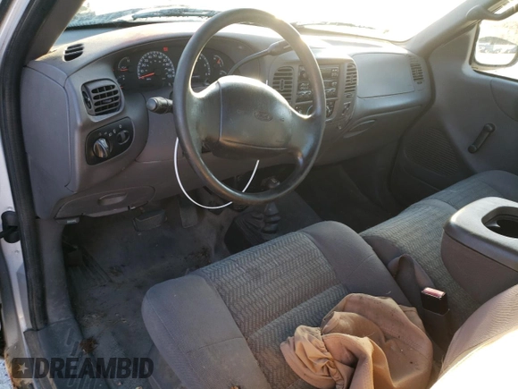 2002 Ford F-150 XL z VIN 1FTRF18212NA49764, wystawiony jako Copart lot #81626174 z przebiegiem Nie podano mil oraz Czysty tytuł • Clean title. Historia ofert i sprzedaży dostępna na DreamBid. Obrazek 8.