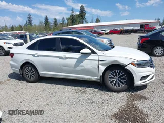 2019 Volkswagen Jetta SEL z VIN 3VWE57BU1KM111170, wystawiony jako IAAI lot #42179819 z przebiegiem 92 300 mil mil oraz . Historia ofert i sprzedaży dostępna na DreamBid. Obrazek 13.