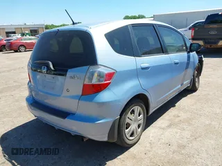 2009 Honda Fit z VIN JHMGE88209S011973, wystawiony jako IAAI lot #42300503 z przebiegiem 106 083 mil mil oraz . Historia ofert i sprzedaży dostępna na DreamBid. Obrazek 4.
