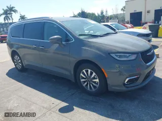 2021 Chrysler Pacifica Hybrid Touring L with VIN 2C4RC1L7XMR586201, listed as a IAAI auction lot 41859340 with 55,906 mi miles. Bid and sale history available at carsss.com. Image 1.