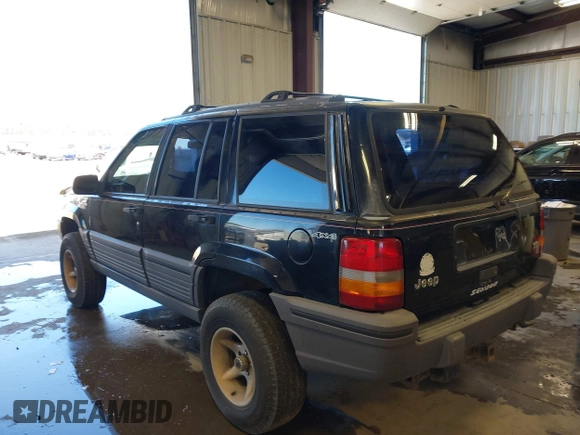 1995 Jeep Grand Cherokee Laredo z VIN 1J4GZ58Y3SC670696, wystawiony jako IAAI lot #42530934 z przebiegiem 165 658 mil mil oraz . Historia ofert i sprzedaży dostępna na DreamBid. Obrazek 3.