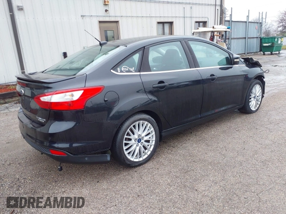 2014 Ford Focus Titanium with VIN 1FADP3J25EL310199, listed as a IAAI auction lot 40682901 with 84,885 mi miles and . Bid and sale history available at DreamBid. Image 4.