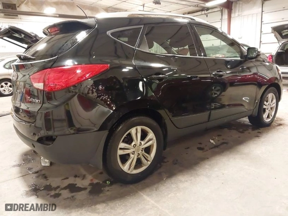 2013 Hyundai Tucson GLS with VIN KM8JU3AC0DU754948, listed as a IAAI auction lot 41811891 with 139,056 mi miles. Bid and sale history available at carsss.com. Image 4.