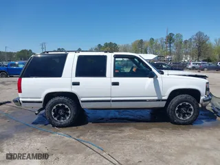 1997 Chevrolet Tahoe with VIN 1GNEK13R8VJ338626, listed as a IAAI auction lot 41976126 with 163,263 mi miles. Bid and sale history available at carsss.com. Image 13.