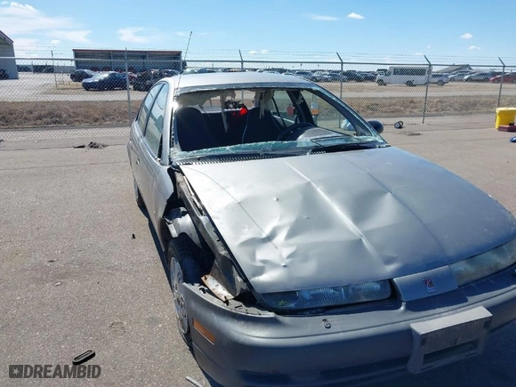 1999 Saturn SL with VIN 1G8ZH5282XZ169243, listed as a IAAI auction lot 41859519 with 224,157 mi miles. Bid and sale history available at carsss.com. Image 6.