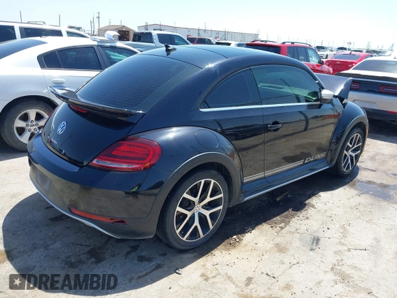 2018 Volkswagen Beetle Dune with VIN 3VWSD7AT1JM702354, listed as a IAAI auction lot 41993527 with 50,952 mi miles and . Bid and sale history available at DreamBid. Image 4.