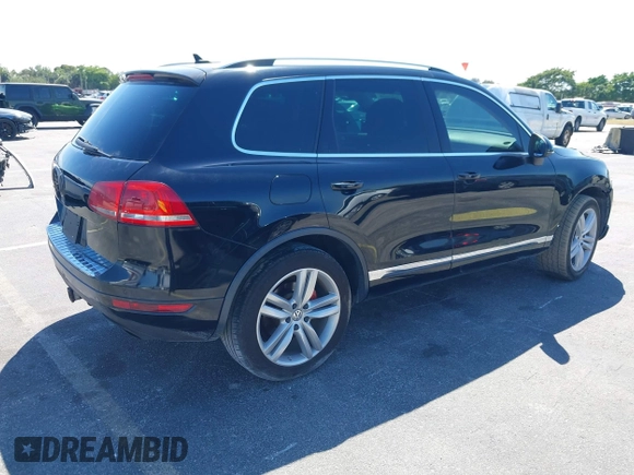 2013 Volkswagen Touareg Lux with VIN WVGEF9BP6DD004454, listed as a IAAI auction lot 41862958 with 239,548 mi miles and . Bid and sale history available at DreamBid. Image 4.