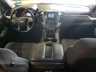 2015 Chevrolet Tahoe LS with VIN 1GNSCAKC9FR301715, listed as a Copart auction lot 64249005 with 107,240 mi miles and Clean title. Bid and sale history available at DreamBid. Image 8.