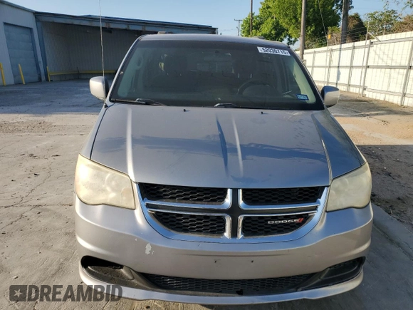 2014 Dodge Grand Caravan SXT with VIN 2C4RDGCG1ER121033, listed as a Copart auction lot 52030715 with 105,451 mi miles and Salvage Title. Bid and sale history available at DreamBid. Image 5.