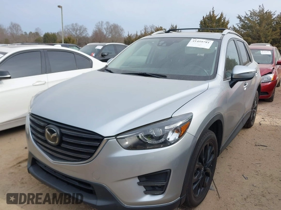 2016 Mazda CX-5 Grand Touring with VIN JM3KE4DY1G0616714, listed as a IAAI auction lot 41459781 with 90,763 mi miles. Bid and sale history available at carsss.com. Image 2.
