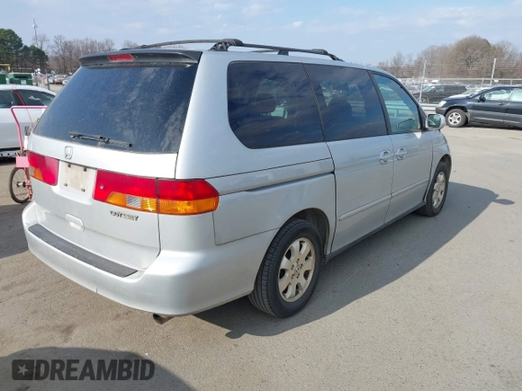 2004 Honda Odyssey EX-L with VIN 5FNRL18964B125664, listed as a IAAI auction lot 41531606 with 327,493 mi miles and . Bid and sale history available at DreamBid. Image 4.
