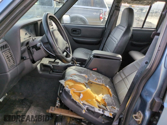 1999 Jeep Cherokee SE with VIN 1J4FF28S5XL646812, listed as a Copart auction lot 87951115 with 230,161 mi miles and Clean title. Bid and sale history available at DreamBid. Image 7.