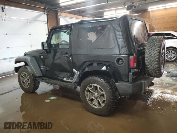 2014 Jeep Wrangler Sport with VIN 1C4AJWAG5EL307945, listed as a Copart auction lot 60152035 with 119,508 mi miles and Salvage title. Bid and sale history available at DreamBid. Image 2.