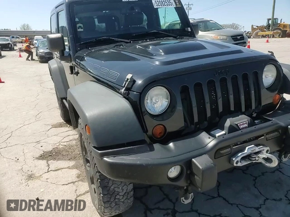 2013 Jeep Wrangler Sahara with VIN 1C4AJWBG8DL602065, listed as a Copart auction lot 52082535 with 110,727 mi miles and Salvage title. Bid and sale history available at DreamBid. Image 13.