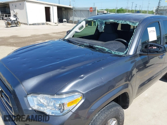 2020 Toyota Tacoma SR with VIN 3TYRX5GNXLT002488, listed as a IAAI auction lot 41973584 with 76,169 mi miles and . Bid and sale history available at DreamBid. Image 6.