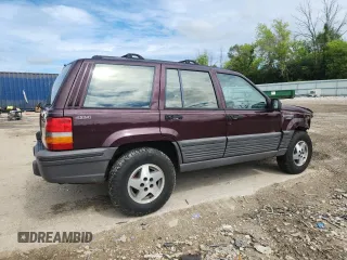 1994 Jeep Grand Cherokee Laredo z VIN 1J4GZ58S0RC221854, wystawiony jako Copart lot #61950825 z przebiegiem 69 465 mil mil oraz Czysty tytuł • Clean title. Historia ofert i sprzedaży dostępna na DreamBid. Obrazek 3.