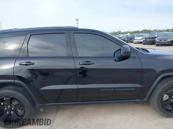 2018 Jeep Grand Cherokee Altitude with VIN 1C4RJFAG9JC436848, listed as a IAAI auction lot 42303459 with 124,044 mi miles and . Bid and sale history available at DreamBid. Image 13.