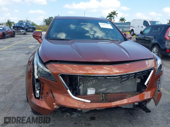 2019 Cadillac XT4 FWD Premium Luxury z VIN 1GYFZCR41KF183507, wystawiony jako IAAI lot #41987176 z przebiegiem 64 803 mil mil oraz . Historia ofert i sprzedaży dostępna na DreamBid. Obrazek 6.