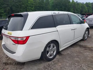 2012 Honda Odyssey Touring with VIN 5FNRL5H93CB034485, listed as a IAAI auction lot 42304502 with 198,589 mi miles and . Bid and sale history available at DreamBid. Image 4.