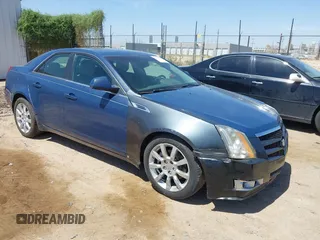 2009 Cadillac CTS RWD z VIN 1G6DV57V990139917, wystawiony jako IAAI lot #42499789 z przebiegiem 130 448 mil mil oraz . Historia ofert i sprzedaży dostępna na DreamBid. Obrazek 1.