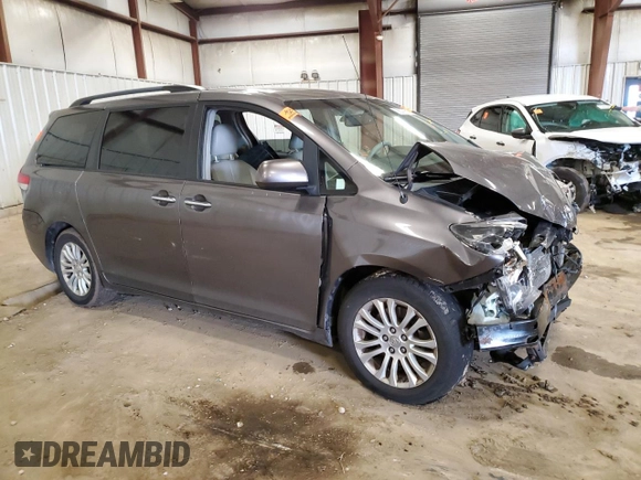 2014 Toyota Sienna XLE with VIN 5TDYK3DC0ES501557, listed as a Copart auction lot 56290015 with Not Provided miles and Clean Title. Bid and sale history available at DreamBid. Image 4.