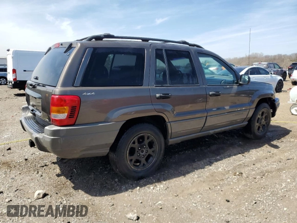 2000 Jeep Grand Cherokee Laredo z VIN 1J4GW48N9YC239166, wystawiony jako Copart lot #53321135 z przebiegiem 142 162 mil mil oraz Szkoda całkowita • Salvage title. Historia ofert i sprzedaży dostępna na DreamBid. Obrazek 3.