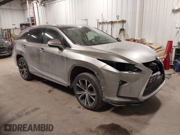 2018 Lexus RX 350L Premium z VIN JTJDZKCA6J2004385, wystawiony jako IAAI lot #41382429 z przebiegiem 111 638 mil mil oraz . Historia ofert i sprzedaży dostępna na DreamBid. Obrazek 1.