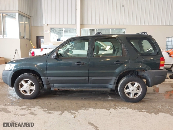 2003 Ford Escape XLS Popular with VIN 1FMYU02143KC35891, listed as a IAAI auction lot 41599760 with 148,381 mi miles. Bid and sale history available at carsss.com. Image 15.