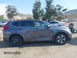 2019 Honda CR-V LX z VIN 2HKRW5H33KH401422, wystawiony jako IAAI lot #42116431 z przebiegiem 119 387 mil mil oraz . Historia ofert i sprzedaży dostępna na DreamBid. Obrazek 14.