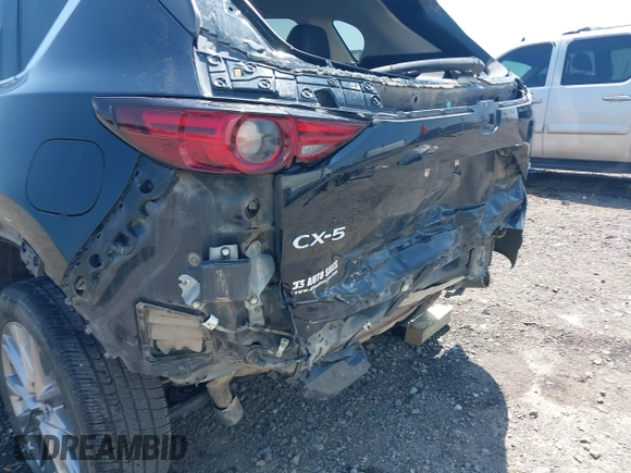 2020 Mazda CX-5 Grand Touring with VIN JM3KFADM9L1837183, listed as a IAAI auction lot 42340628 with 81,975 mi miles and . Bid and sale history available at DreamBid. Image 18.