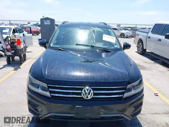 2021 Volkswagen Tiguan S with VIN 3VV1B7AX9MM067347, listed as a IAAI auction lot 42305101 with 77,042 mi miles and . Bid and sale history available at DreamBid. Image 12.