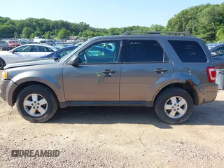 2012 Ford Escape XLT z VIN 1FMCU9DG7CKB28270, wystawiony jako IAAI lot #42607520 z przebiegiem 129 758 mil mil oraz . Historia ofert i sprzedaży dostępna na DreamBid. Obrazek 14.