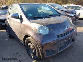 2014 Scion iQ with VIN JTNJJXB09EJ030215, listed as a IAAI auction lot 41329143 with 126,954 mi miles. Bid and sale history available at carsss.com. Image 1.