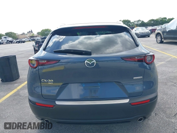 2023 Mazda CX-30 S Carbon Edition with VIN 3MVDMBCM4PM579080, listed as a IAAI auction lot 41941082 with 5,444 mi miles and . Bid and sale history available at DreamBid. Image 16.