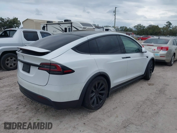 2022 Tesla Model X with VIN 7SAXCBE56NF364067, listed as a IAAI auction lot 40947378 with Not Provided miles and . Bid and sale history available at DreamBid. Image 4.