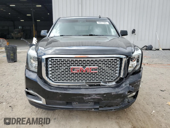 2015 GMC Yukon Denali with VIN 1GKS1CKJ0FR140877, listed as a Copart auction lot 50917985 with 180,726 mi miles and Salvage Title. Bid and sale history available at carsss.com. Image 5.
