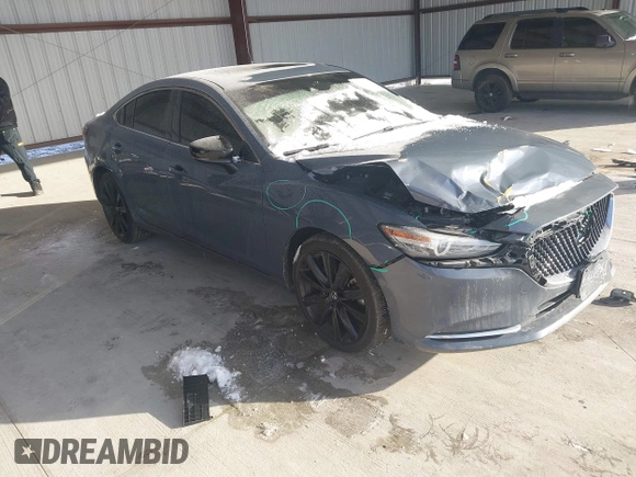 2021 Mazda 6 Carbon Edition with VIN JM1GL1WY6M1616617, listed as a IAAI auction lot 41365615 with 60,747 mi miles and . Bid and sale history available at DreamBid. Image 1.