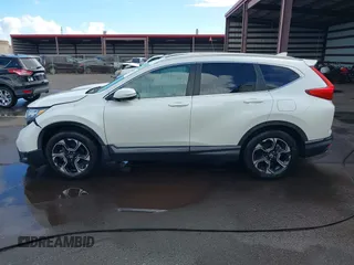 2018 Honda CR-V Touring with VIN 2HKRW1H96JH506435, listed as a IAAI auction lot 41228873 with 11,585 mi miles and . Bid and sale history available at DreamBid. Image 15.